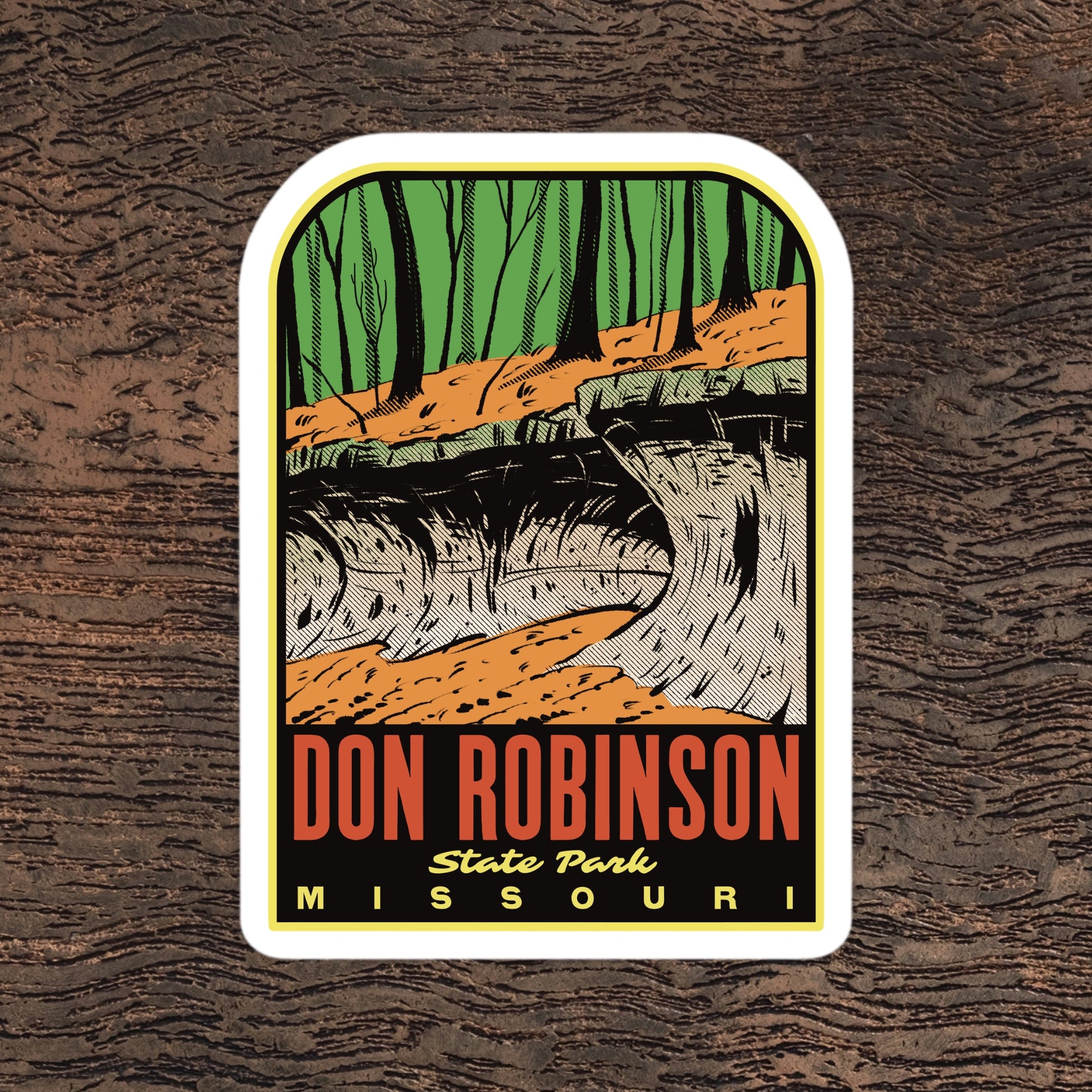 A sticker of Don Robinson State Park Missouri on a wood surface