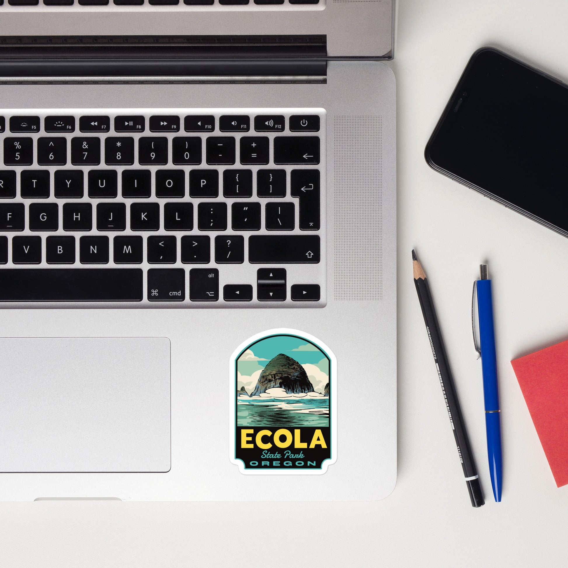 A sticker of Ecola State Park on a laptop