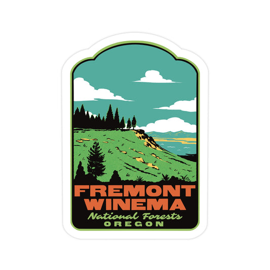 A die-cut sticker featuring a retro-style scenic illustration of Fremont-Winema National Forests in Oregon. The design shows a green hillside, dark pine trees, a teal sky with white clouds, and bold orange and green text at the bottom reading 'FREMONT WINEMA National Forests OREGON'.