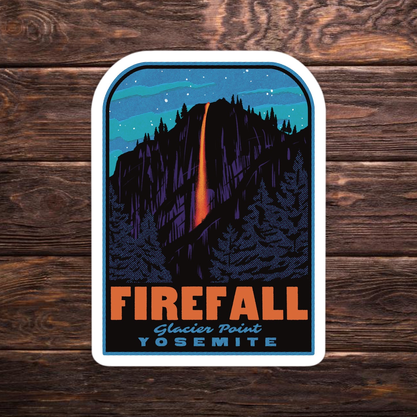 Sticker of Firefall at Glacier Point, Yosemite on a wooden background