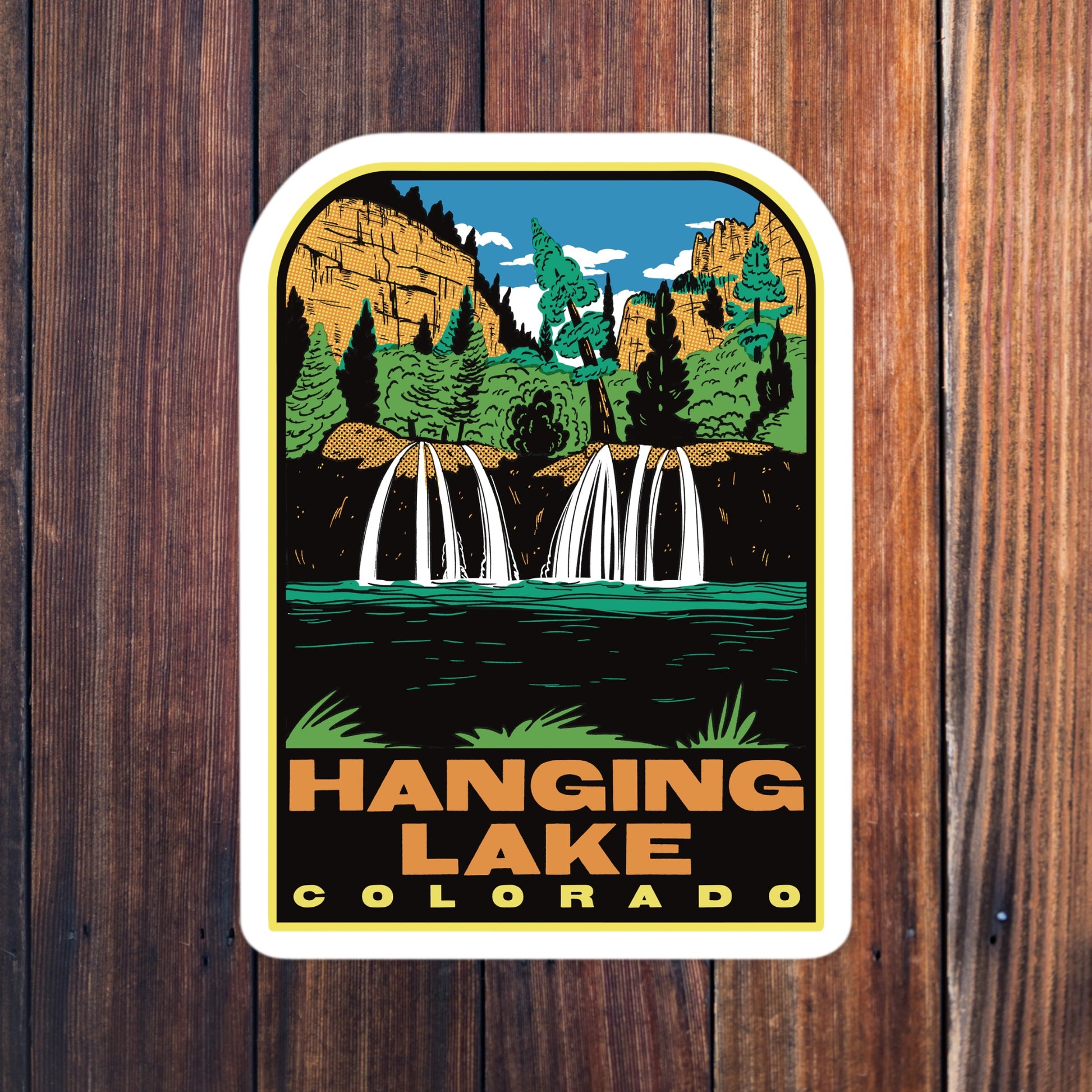 Sticker of Hanging Lake, Colorado with a scenic illustration on a wooden background