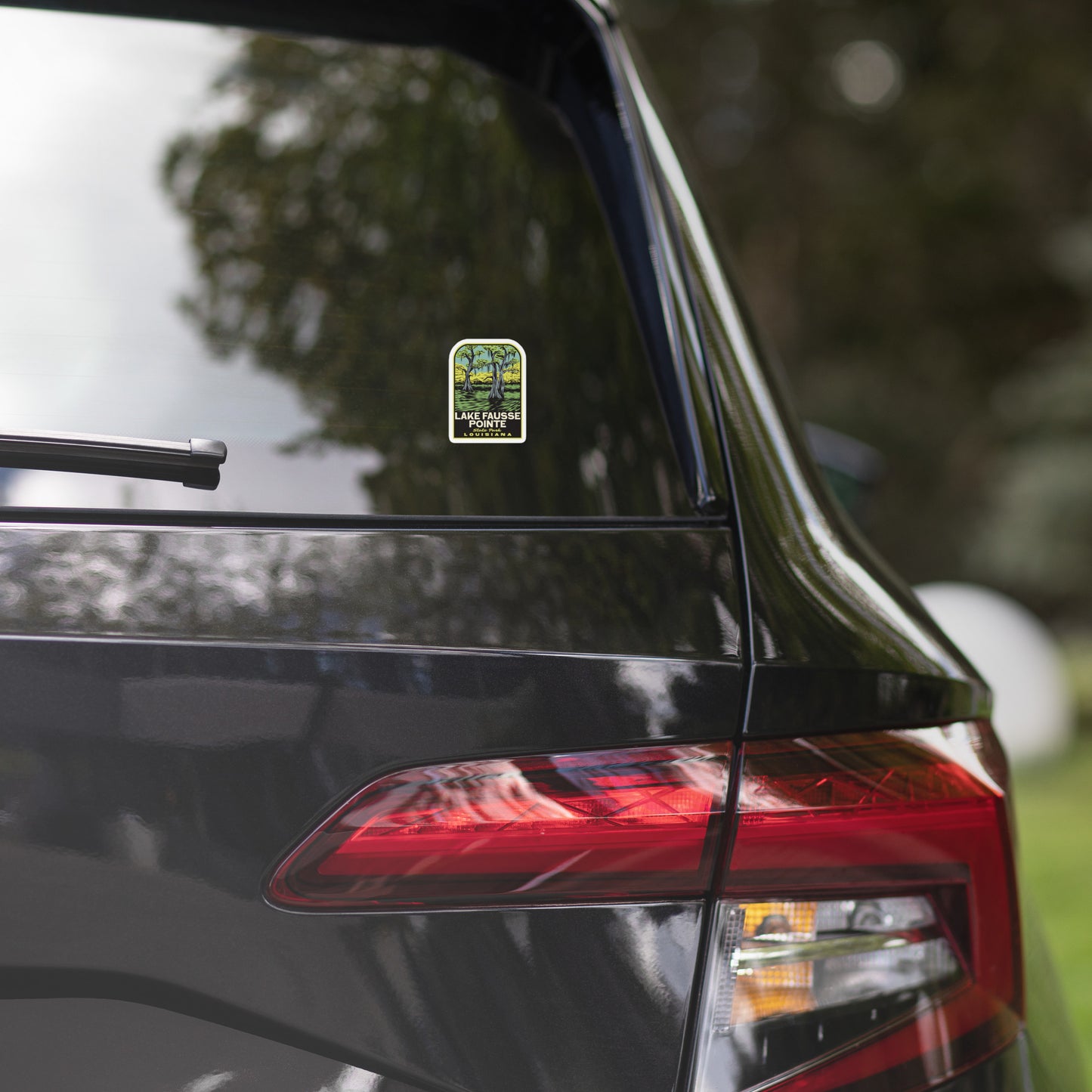 A retro sticker of Lake Fausse State Park Louisiana on a car window