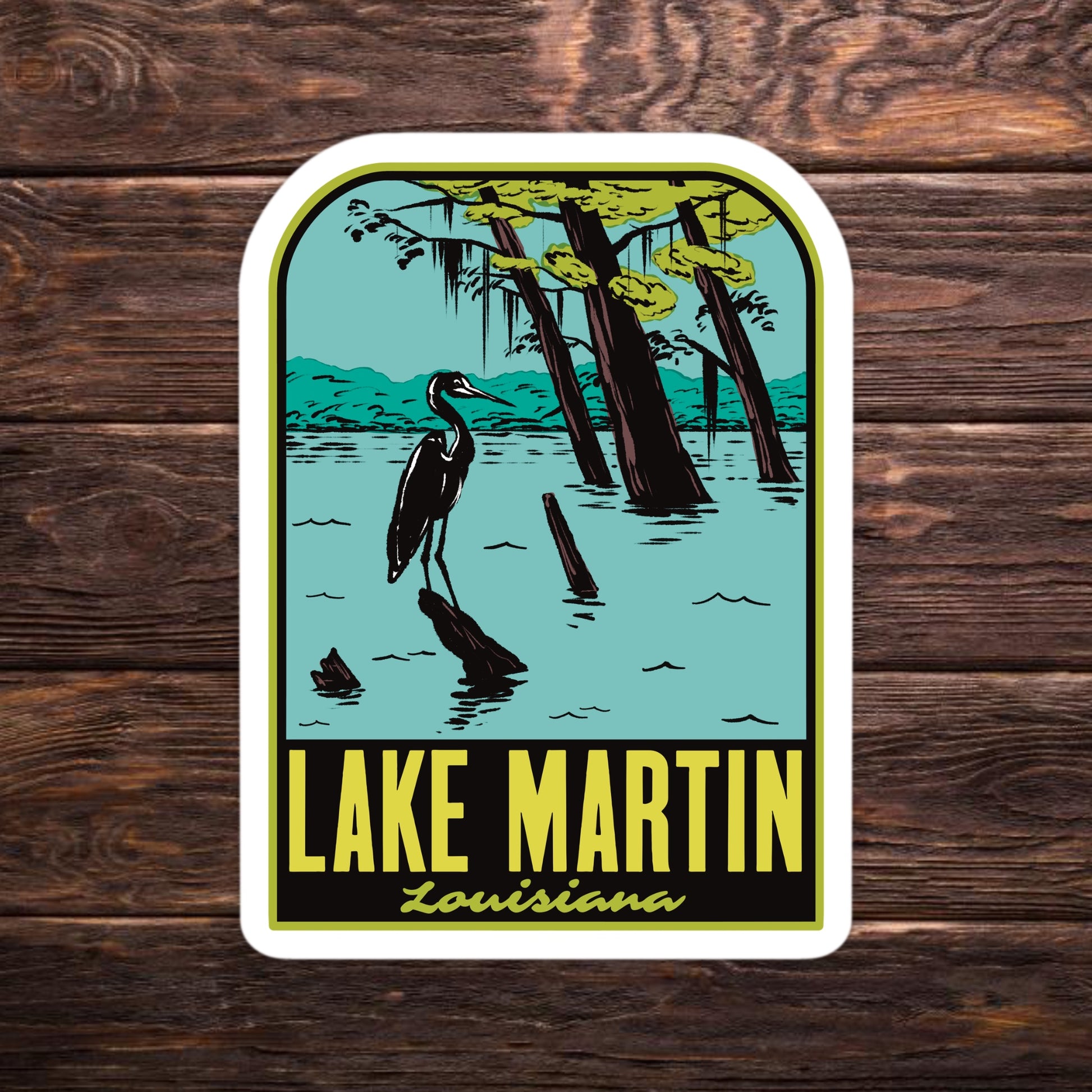 Sticker of Lake Martin, Louisiana with a heron and trees on a wooden background