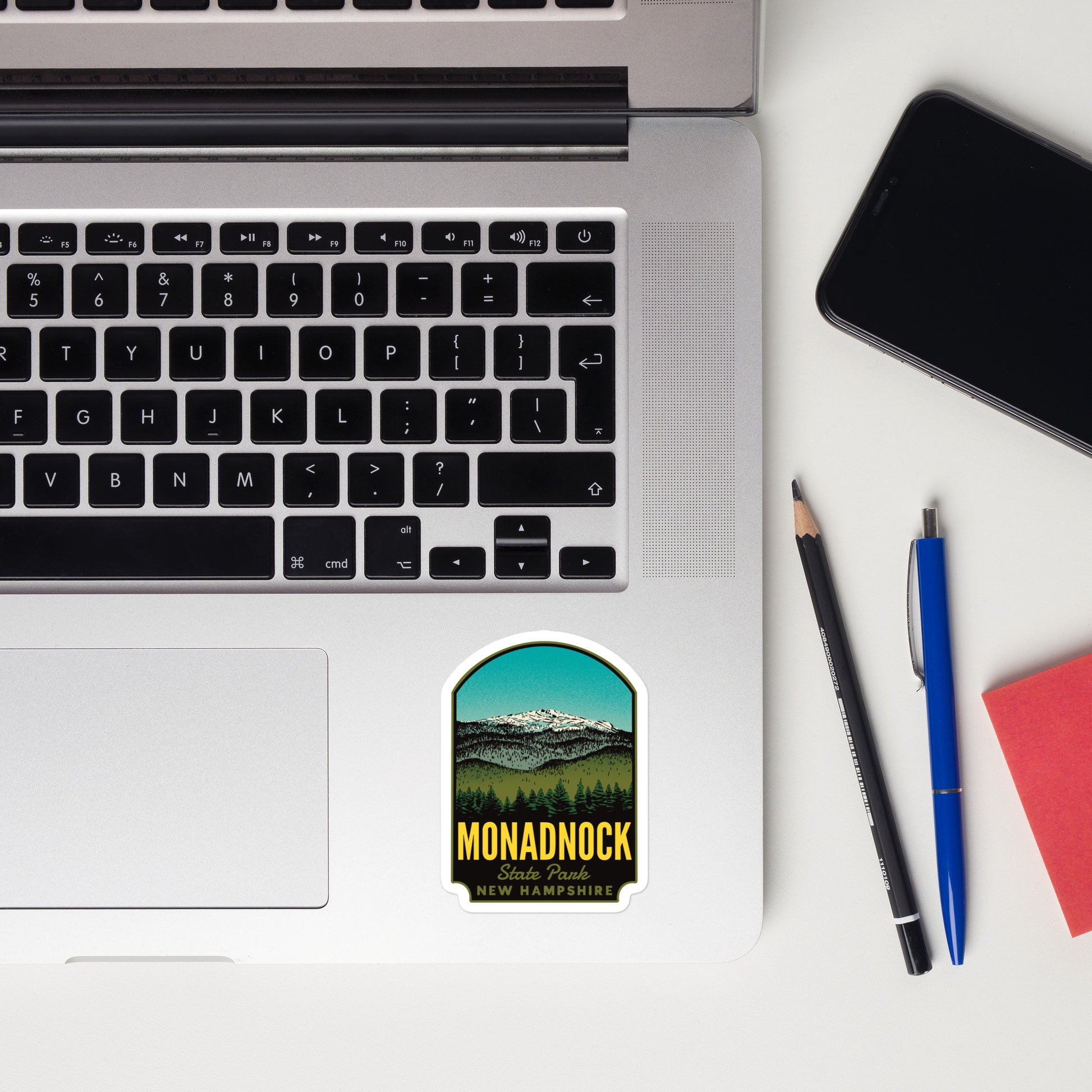 A sticker of Monadnock State Park on a laptop