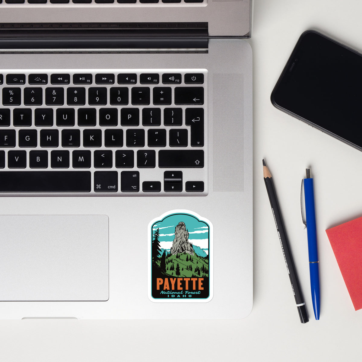 a sticker of Payette National Forest on a laptop