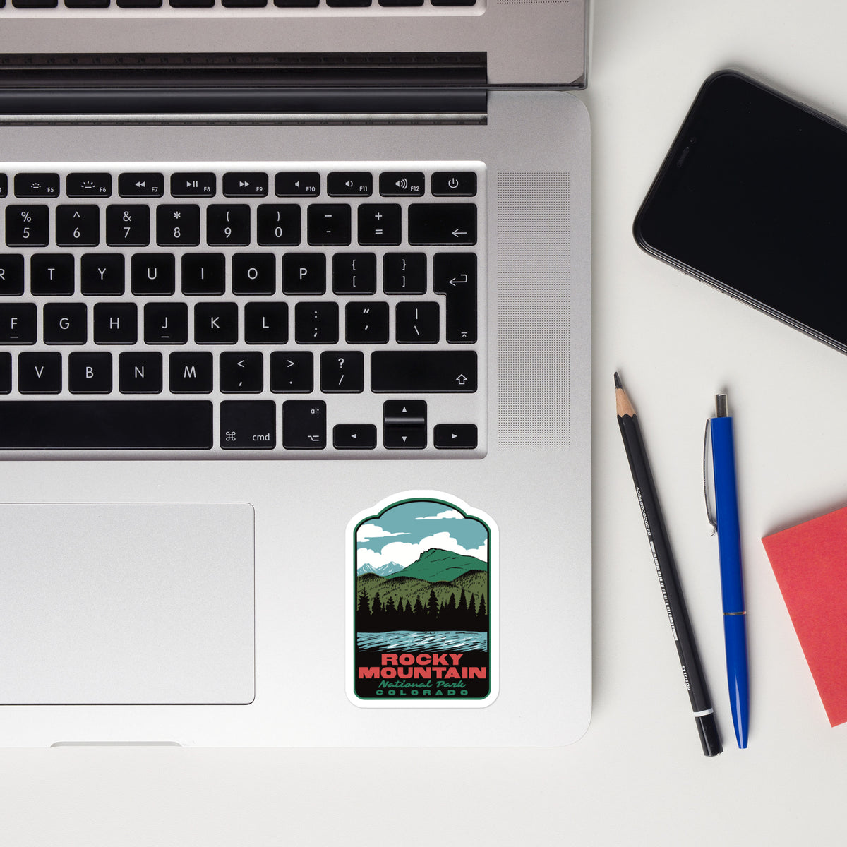 a sticker of Lily Lake in Rocky Mountain National Park on a laptop palm rest