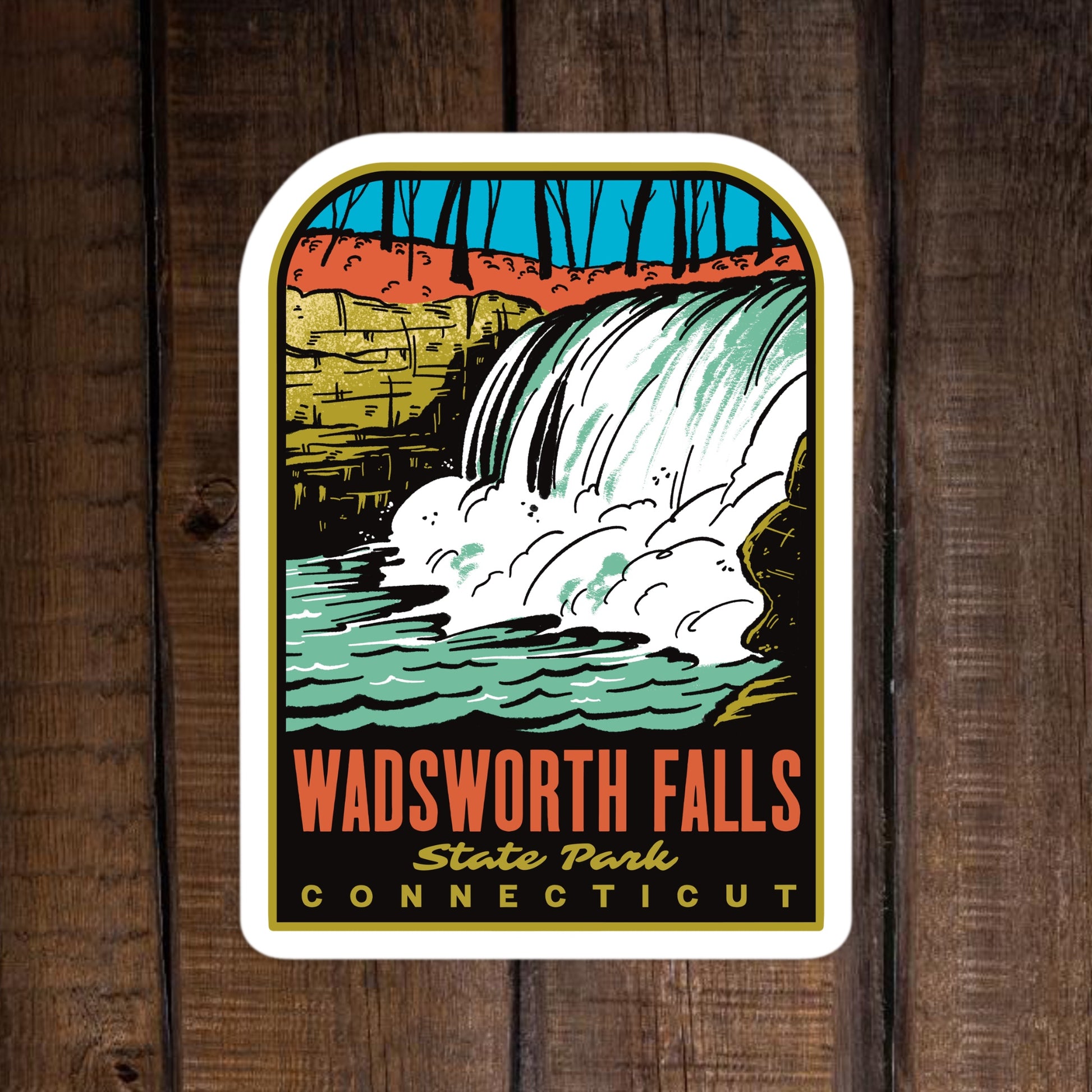 A sticker of Wadsworth Falls State Park Connecticut on a wood surface