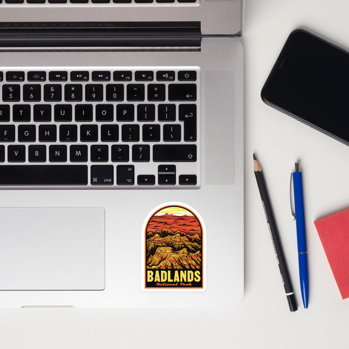 a sticker of Badlands National Park on a laptop