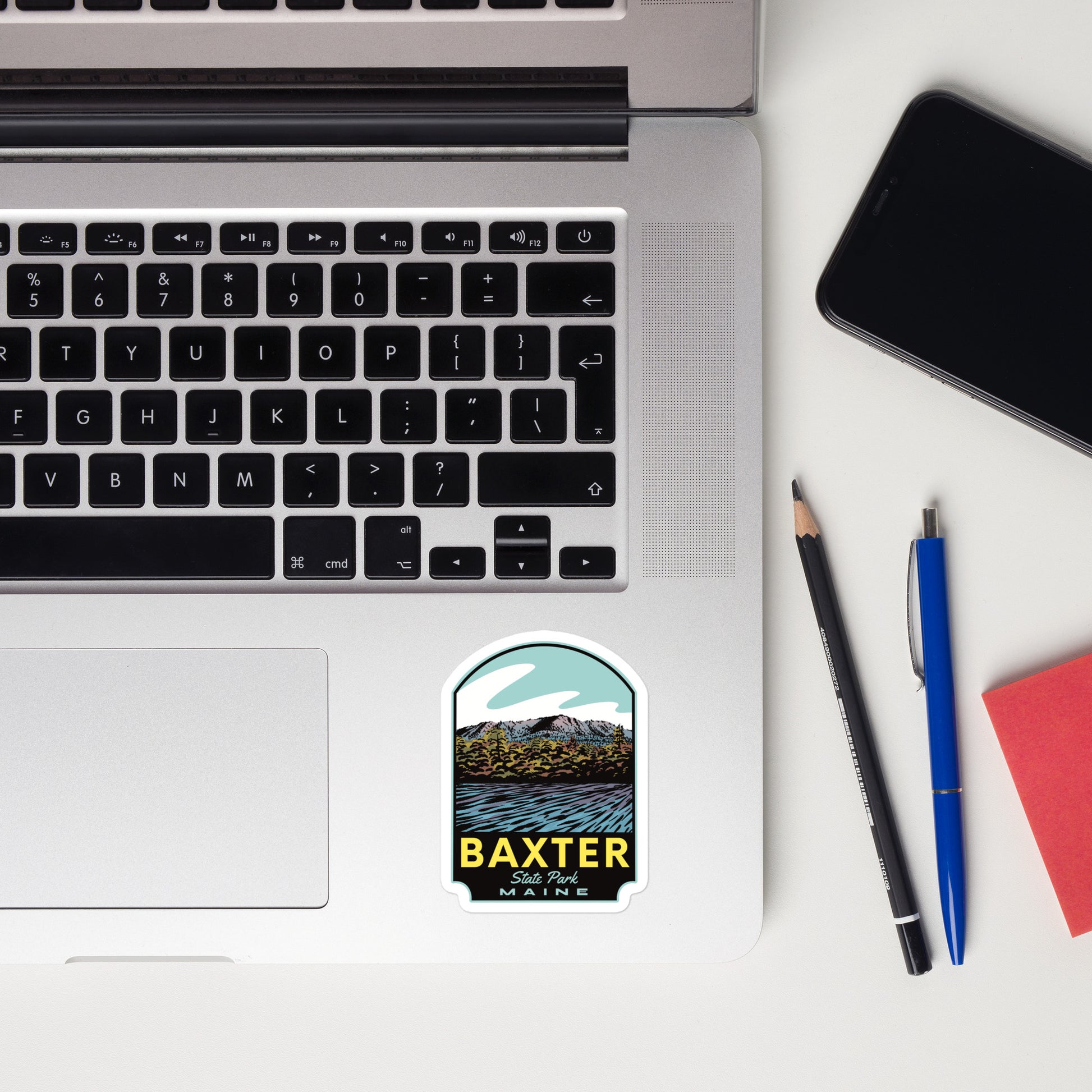 A sticker of Baxter State Park on a laptop