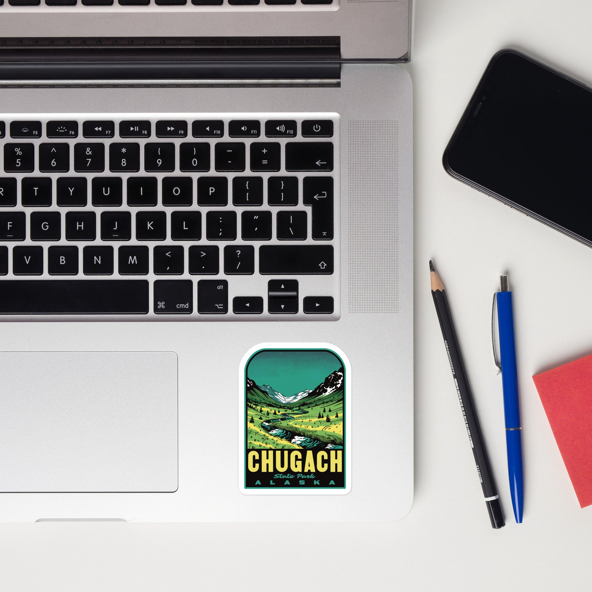 Chugach State Park vinyl decal in retro style displayed on laptop—features Alaska nature and half tones in mid-century design, perfect for travelers and state park lovers
