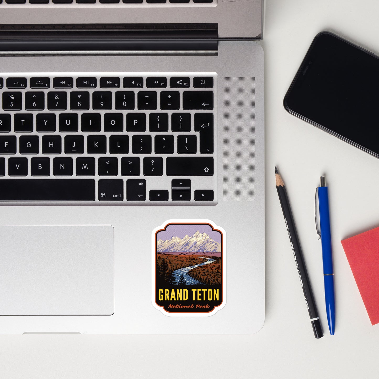 A sticker of Grand Teton National Park on a laptop