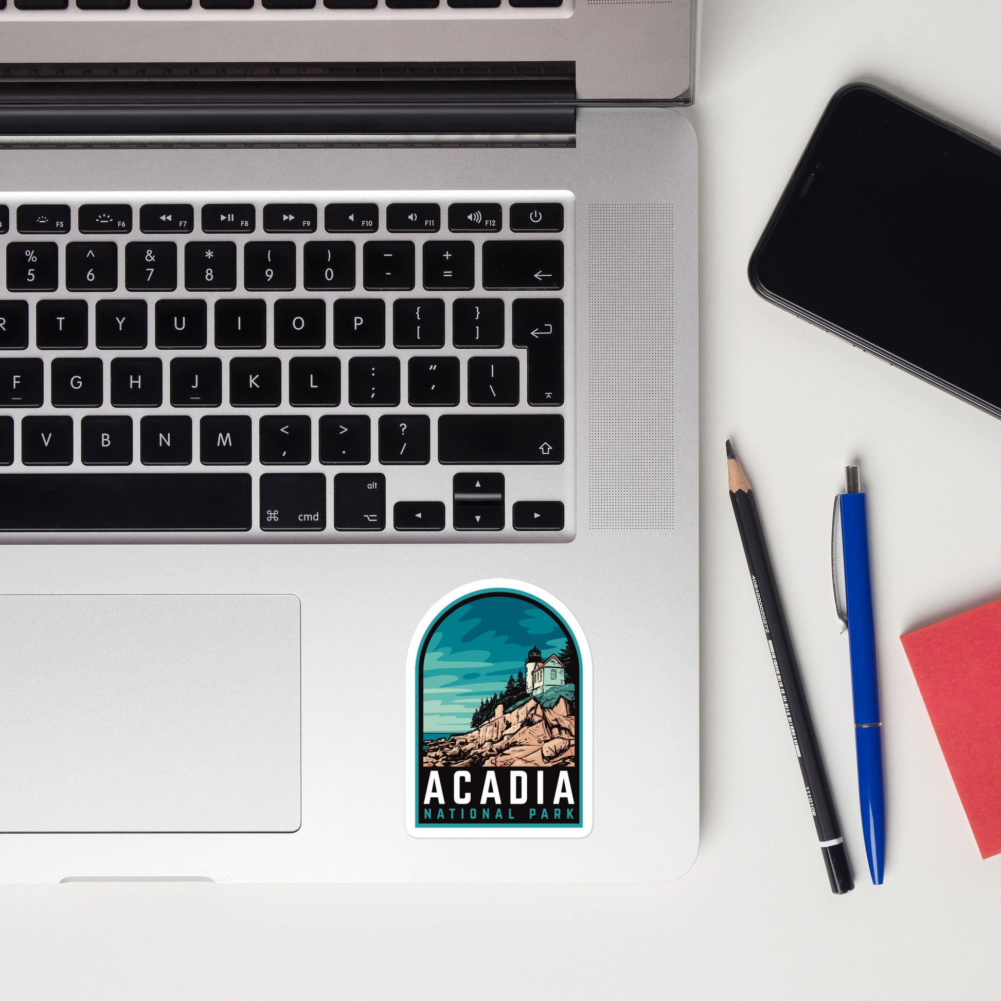 A 3 inch tall sticker of Acadia National Park on a laptop