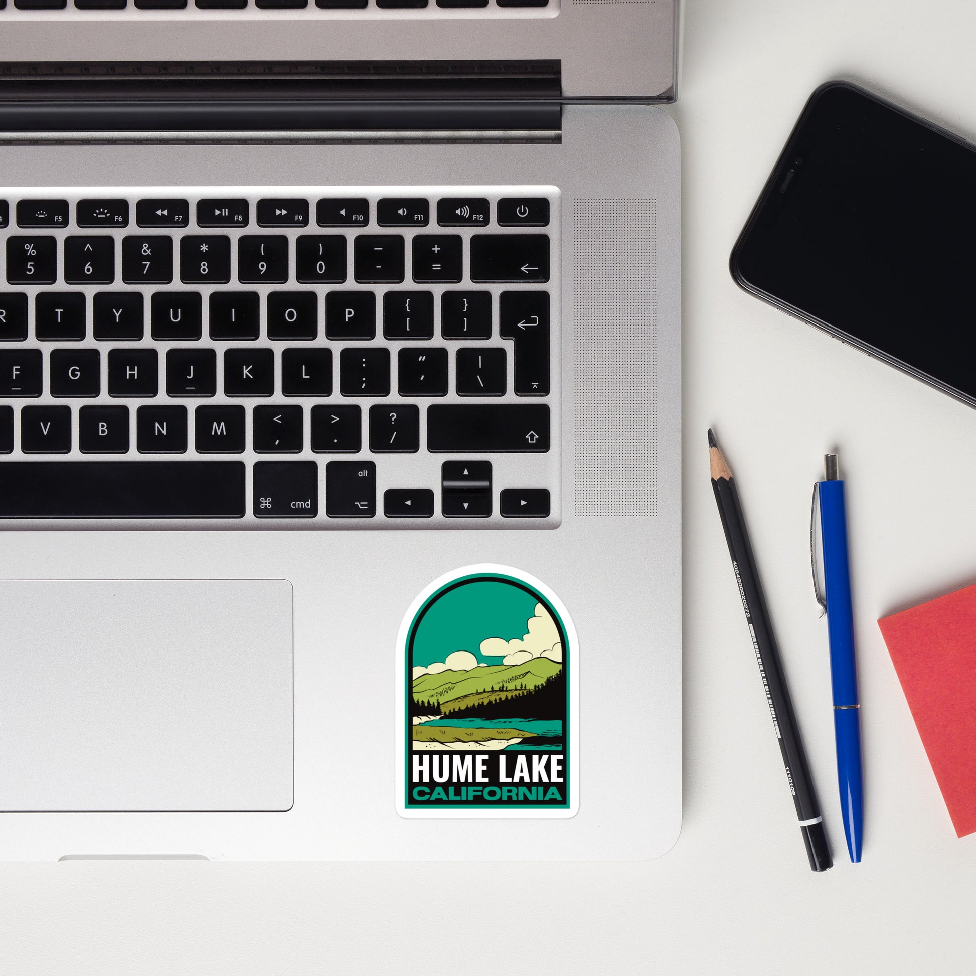 A sticker of Hume Lake California on a laptop