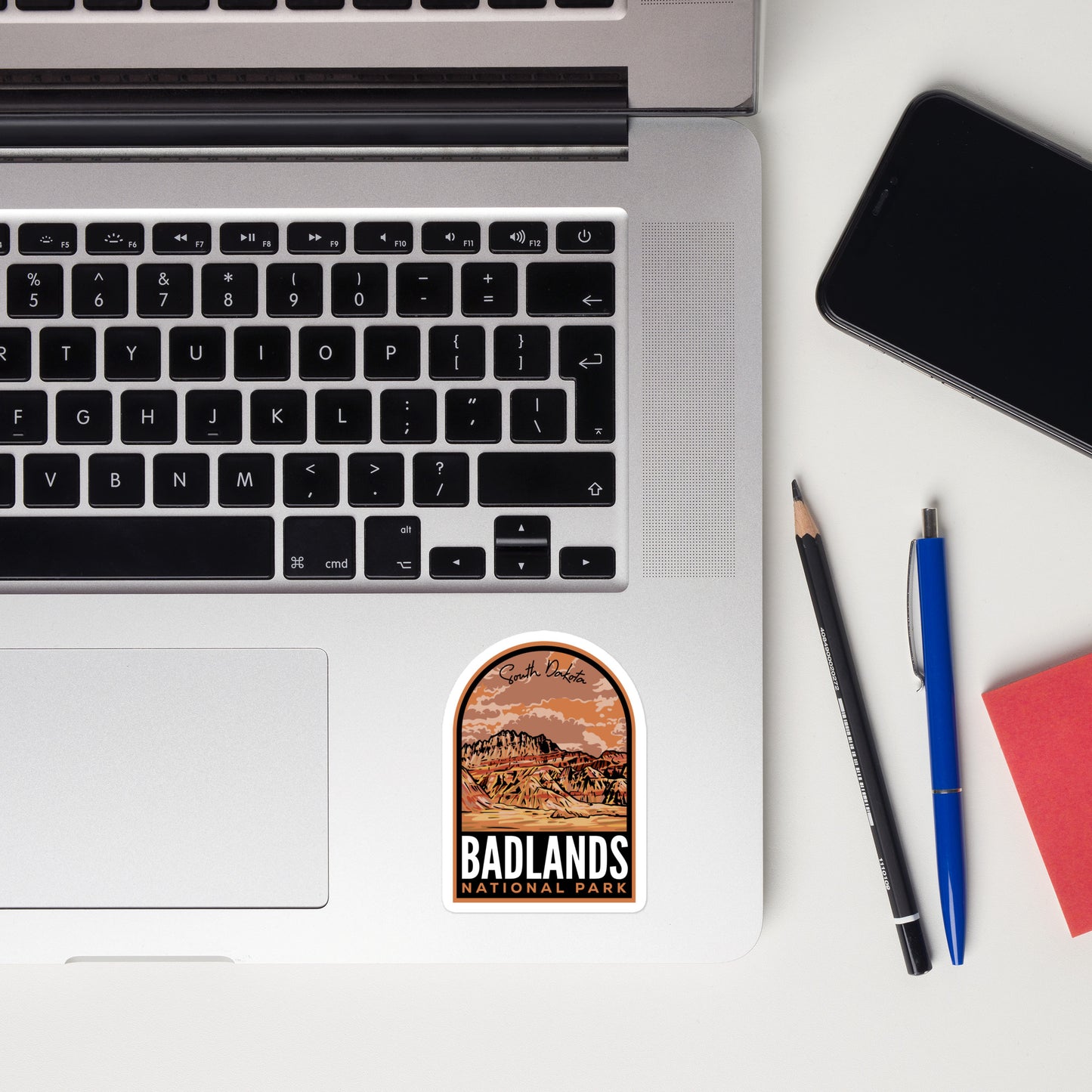 A 3 inch sticker of Badlands National Park on a laptop