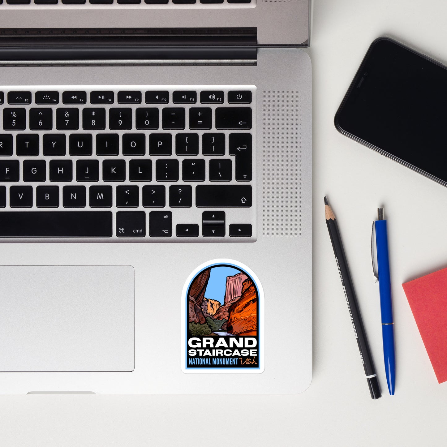 A sticker of Grand Staircase National Monument on a laptop