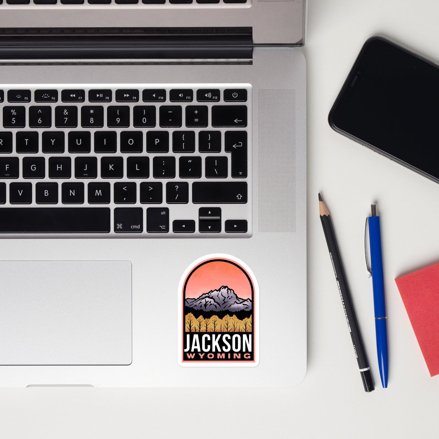 A sticker of Jackson Wyoming on a laptop