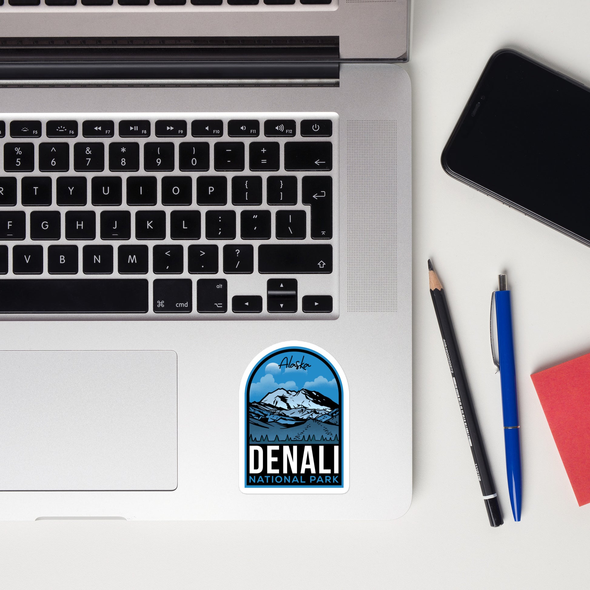 A sticker of Denali National Park on a laptop