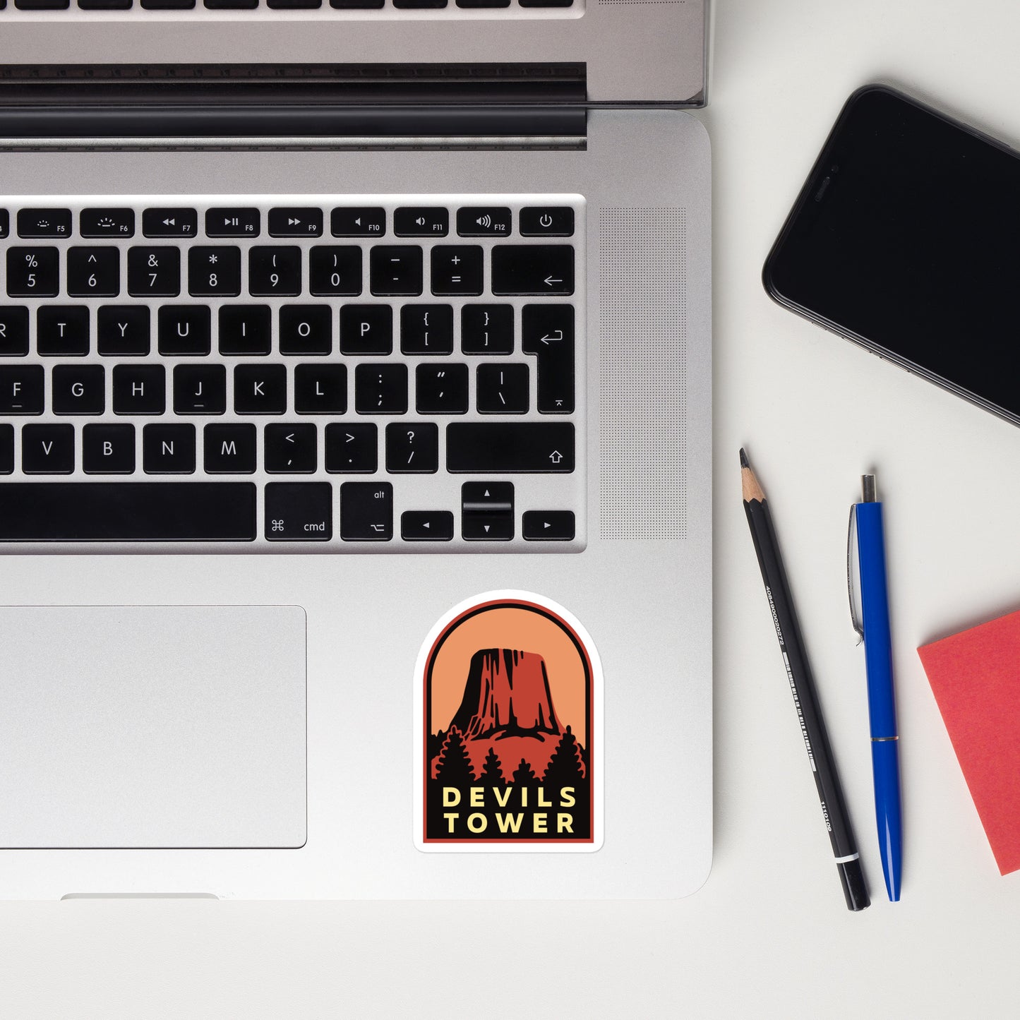 A sticker of Devils Tower Wyoming on a laptop
