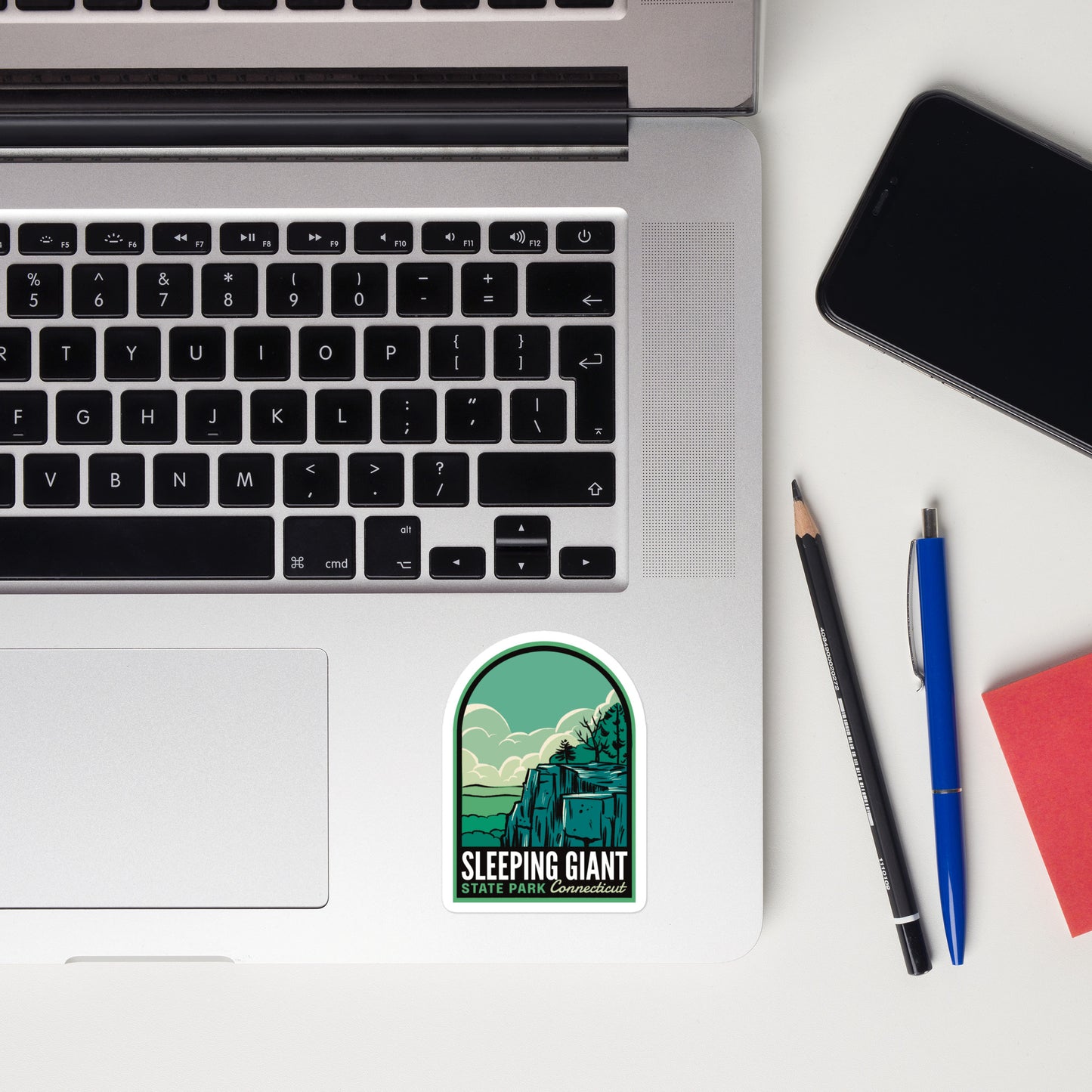 A sticker of Sleeping Giant State Park on a laptop