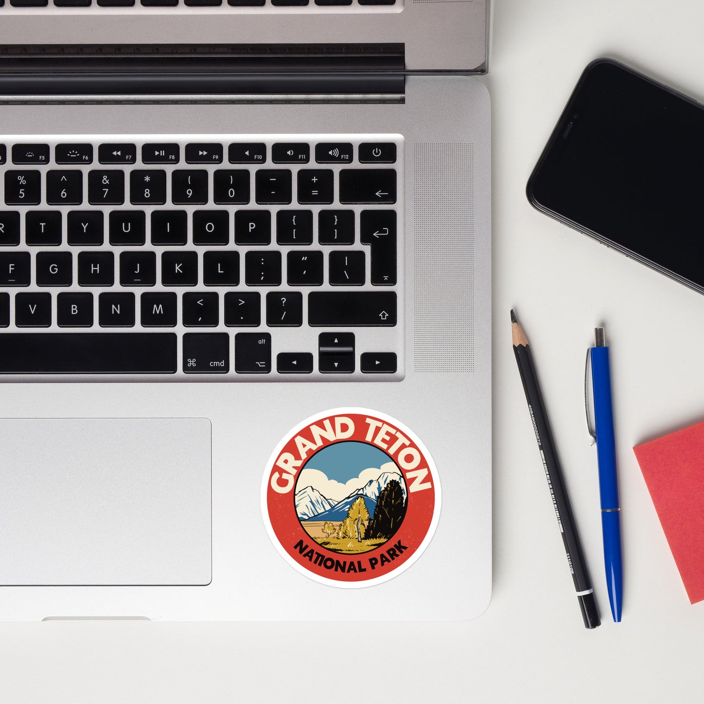 A sticker of Grand Teton National Park on a laptop