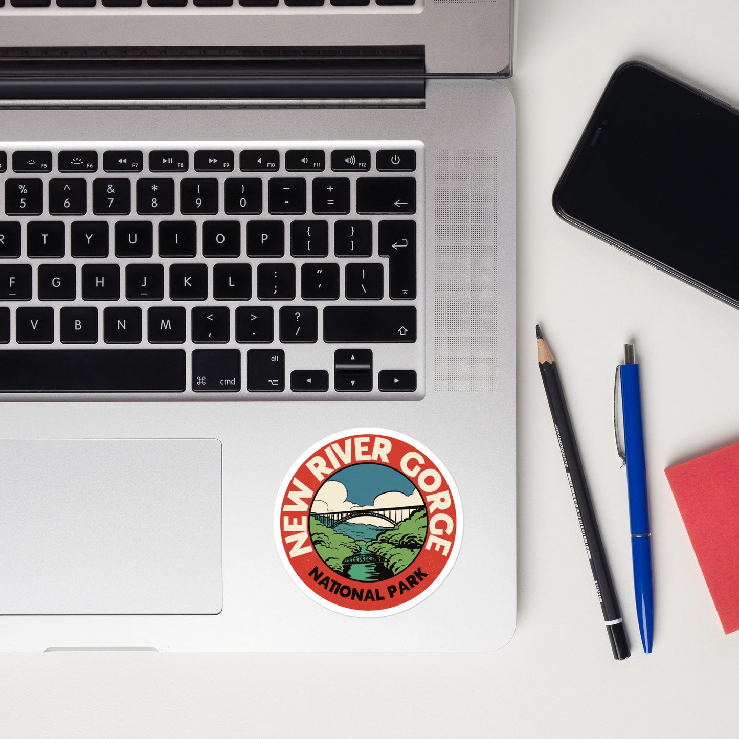 A sticker of New River Gorge National Park on a laptop