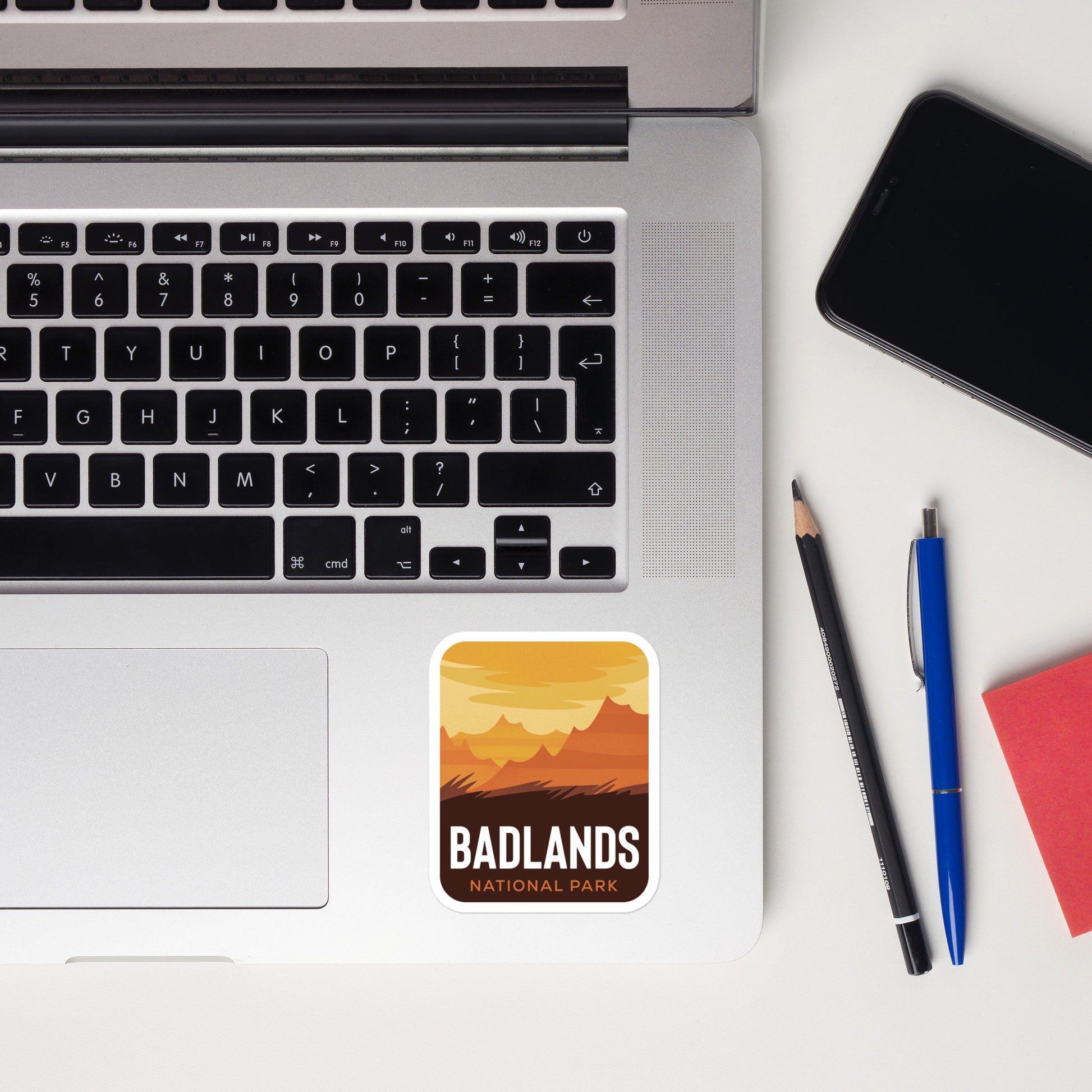 A sticker of Badlands National Park on a laptop