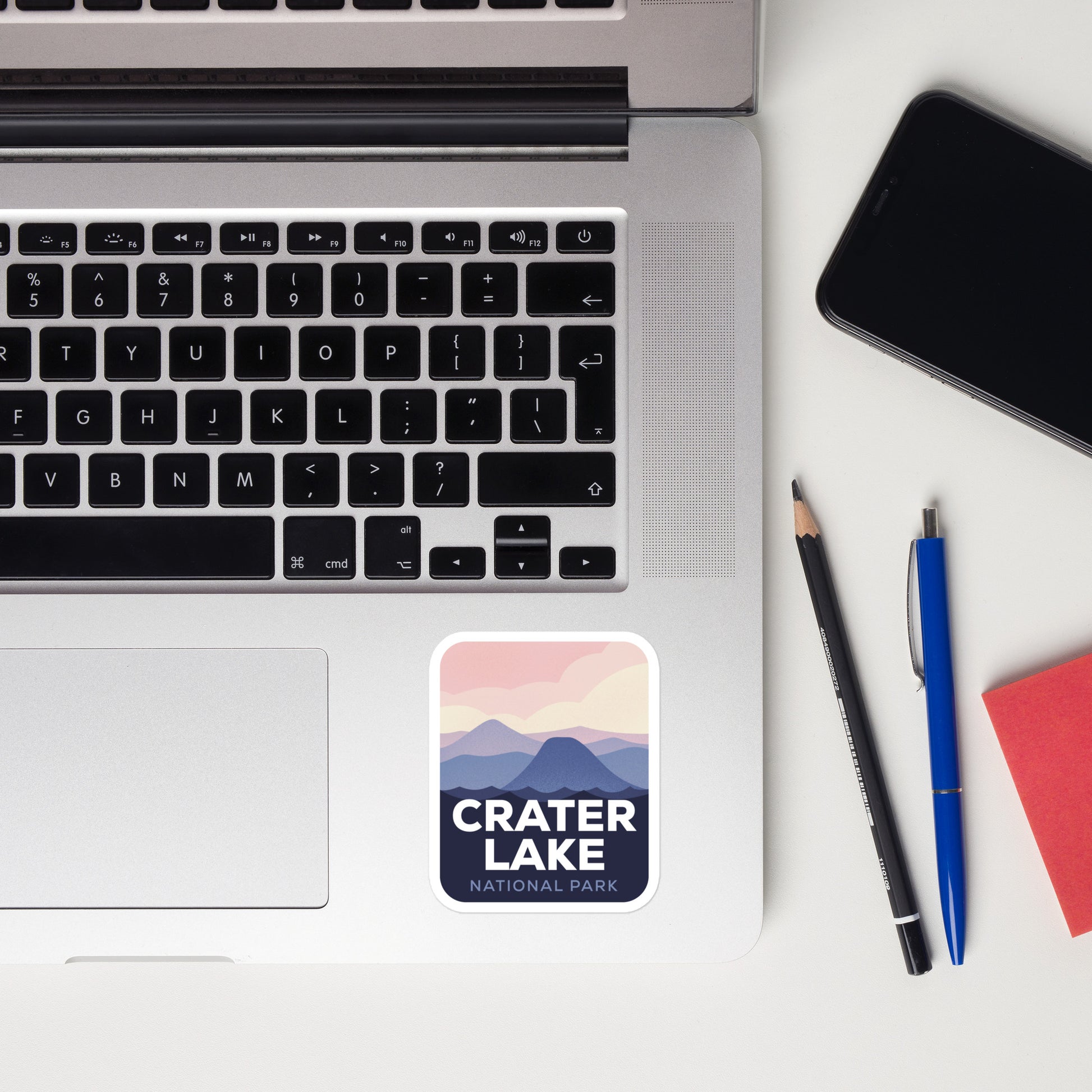 A sticker of Crater Lake National Park on a laptop