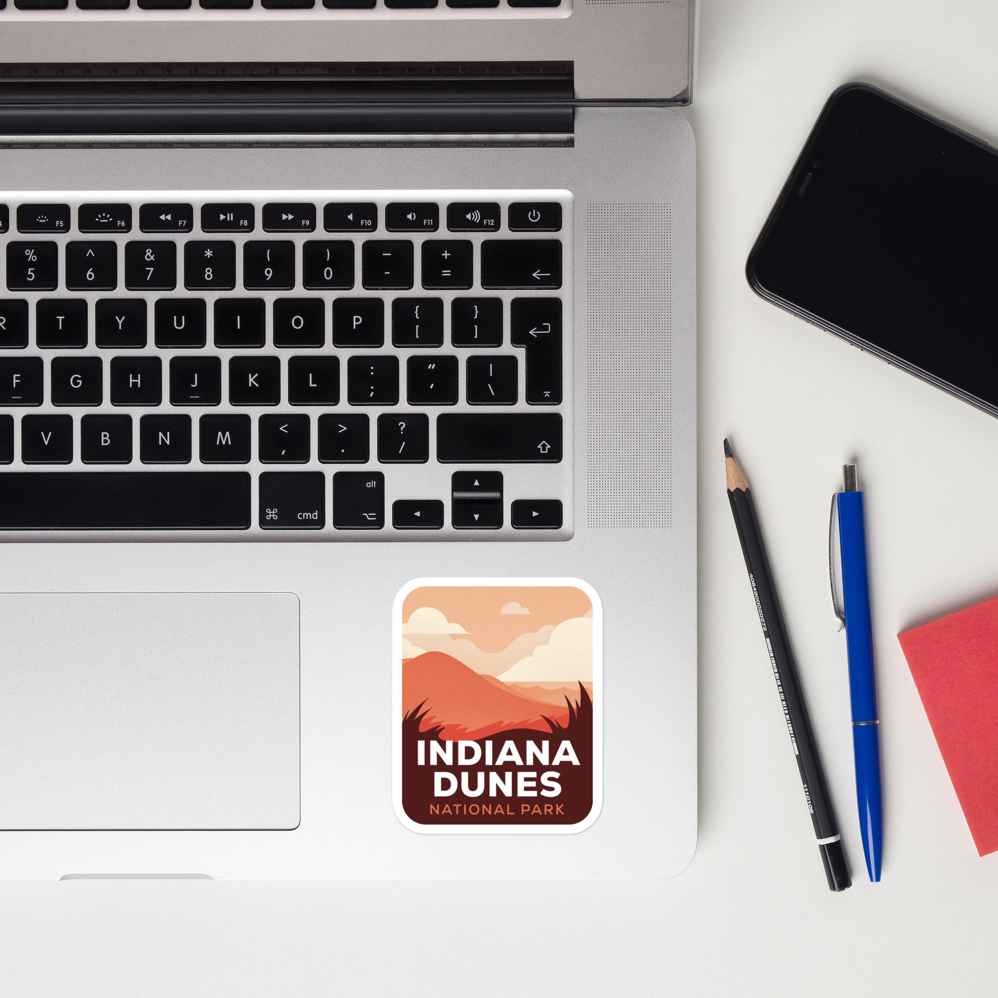 A sticker of Indiana Dunes National Park on a laptop