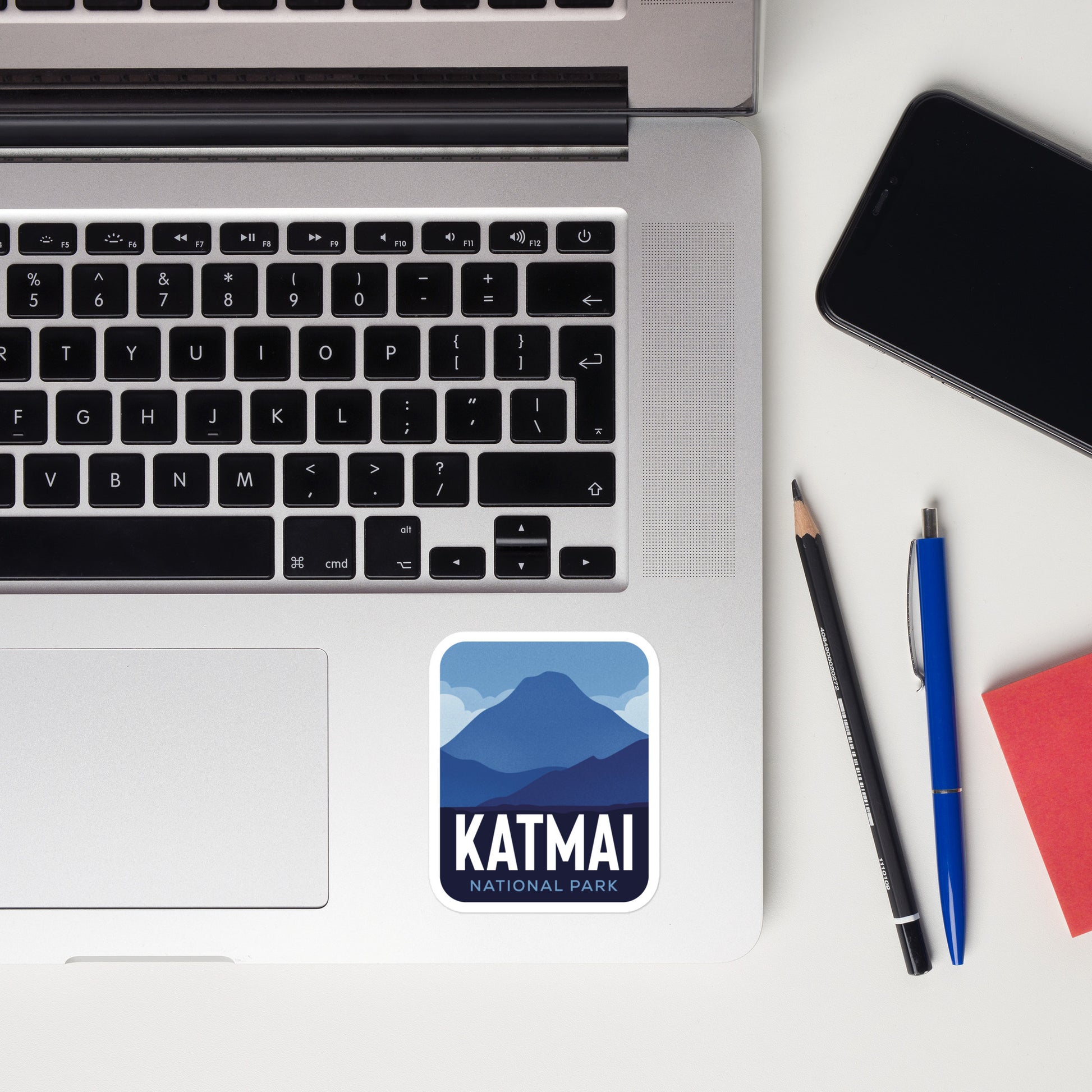 A sticker of Katmai National Park on a laptop