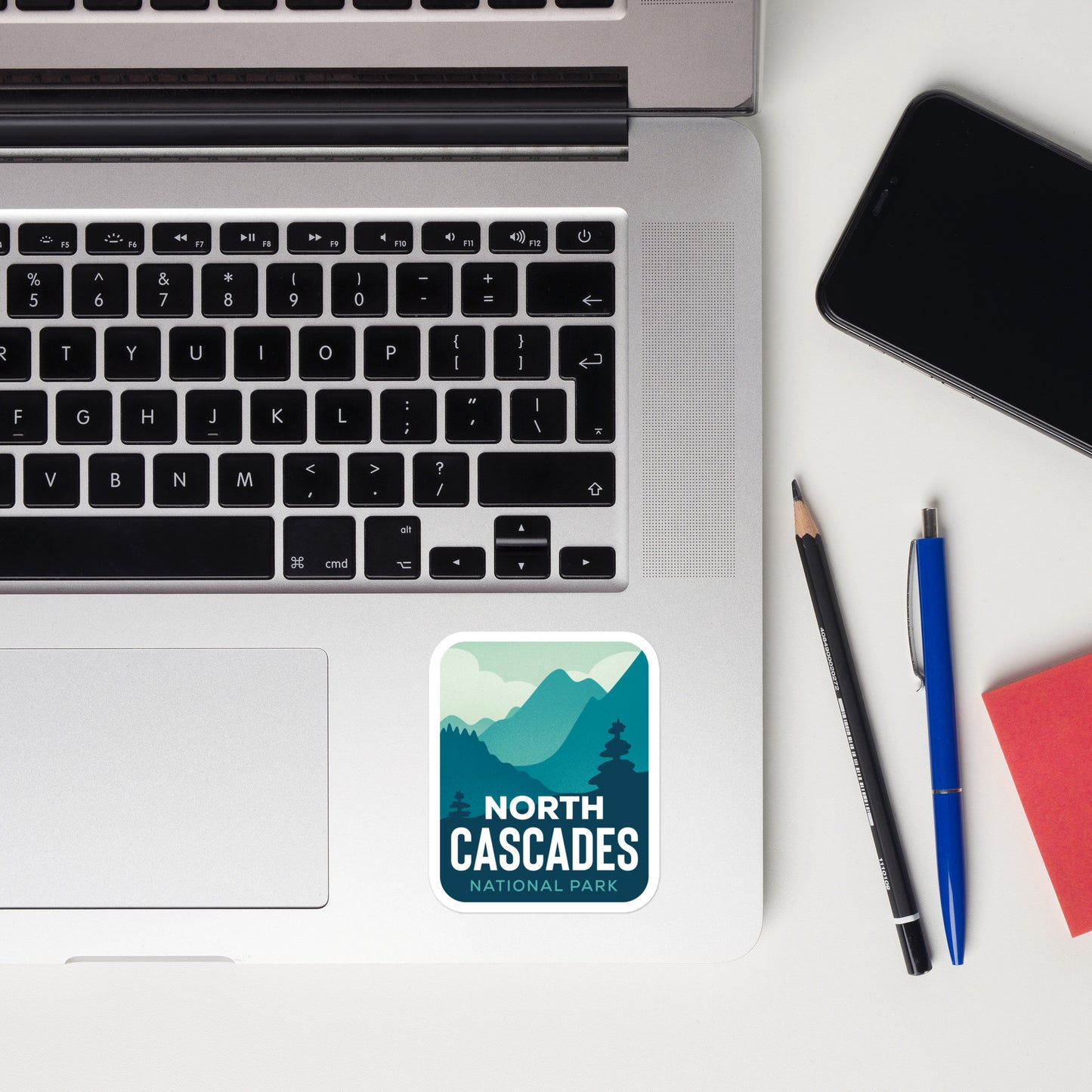 A sticker of North Cascades National  Park on a laptop