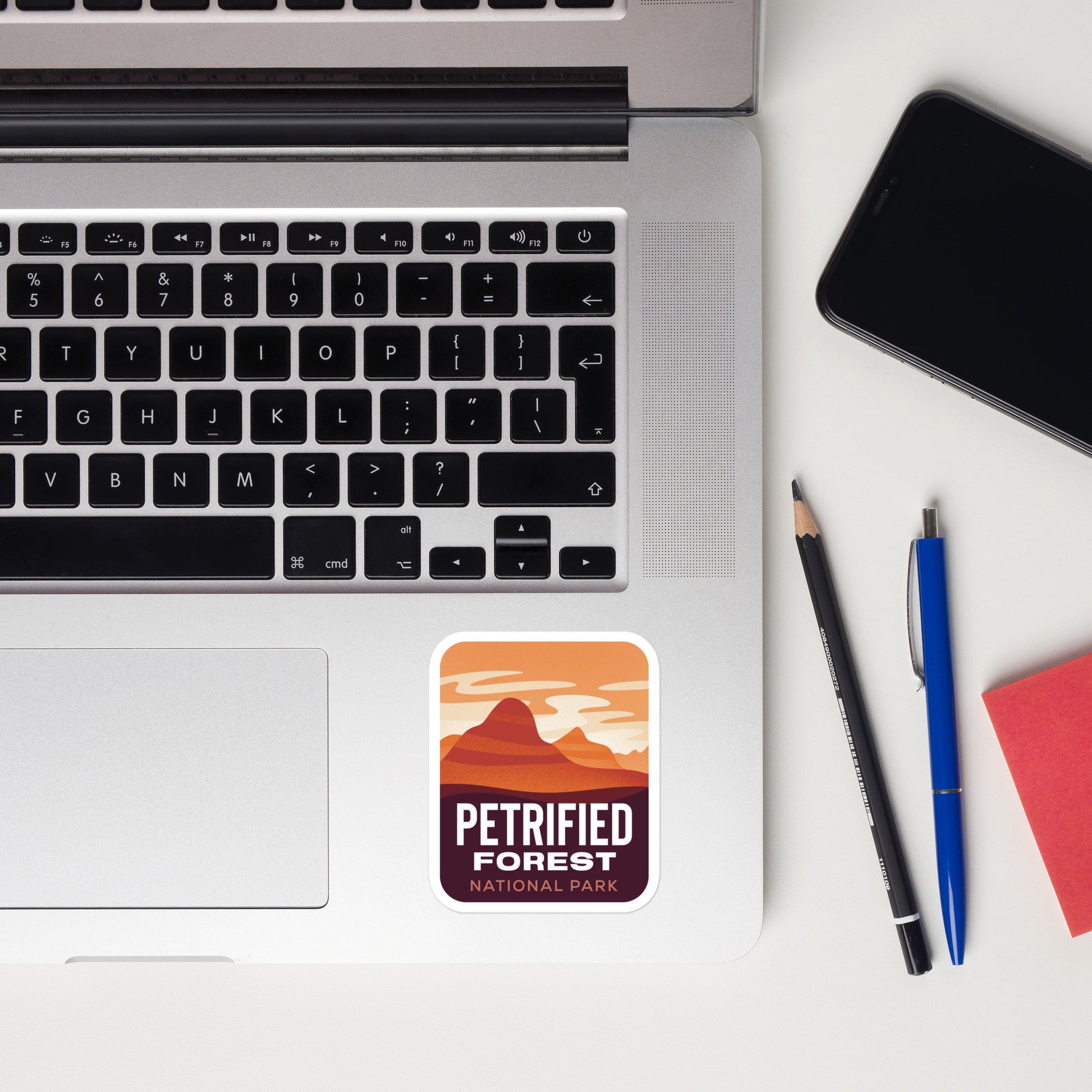 A sticker of Petrified Forest National Park on a laptop