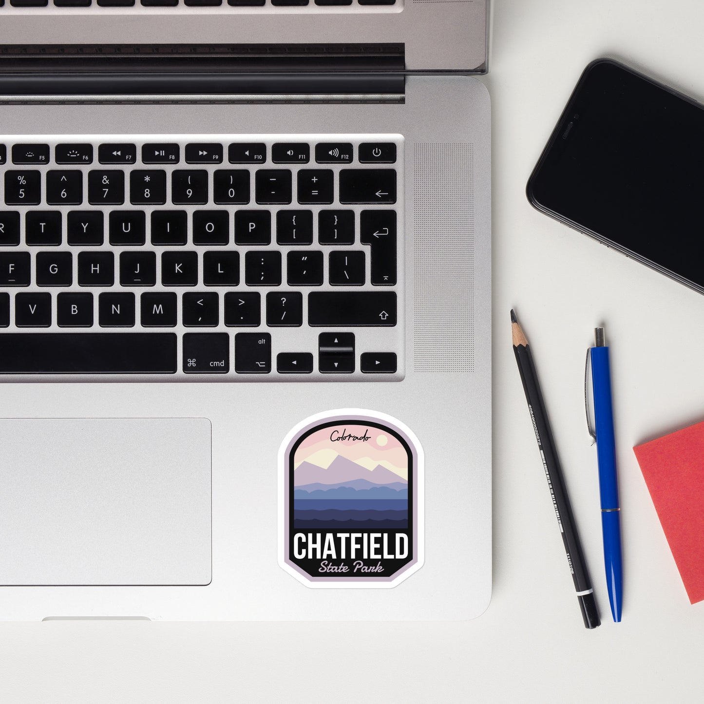 A sticker of Chatfield State Park on a laptop