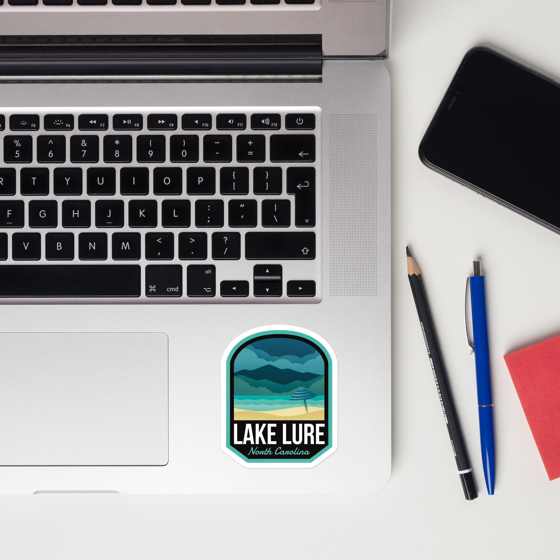 A sticker of Lake Lure North Carolina on a laptop