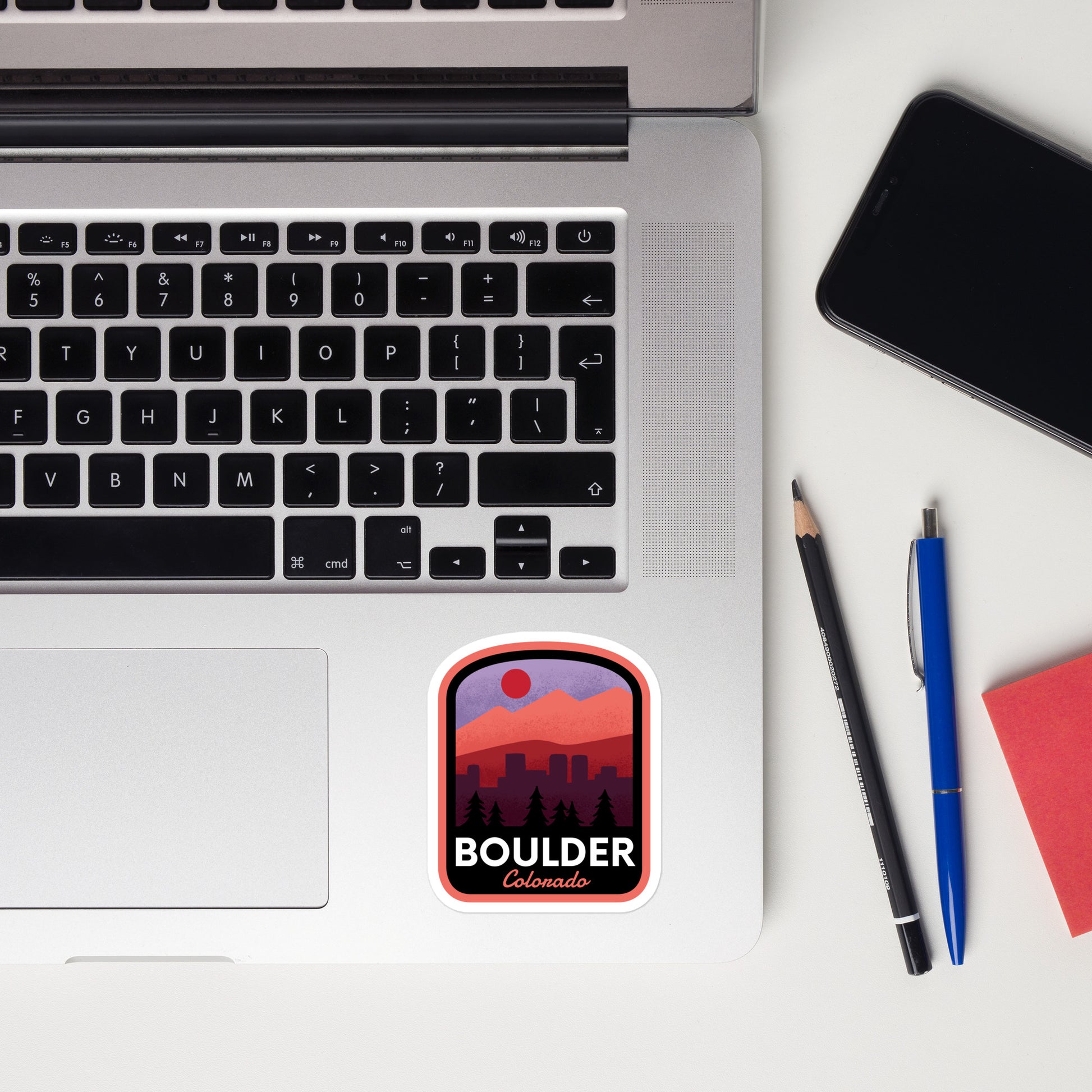 A sticker of Boulder Colorado on a laptop
