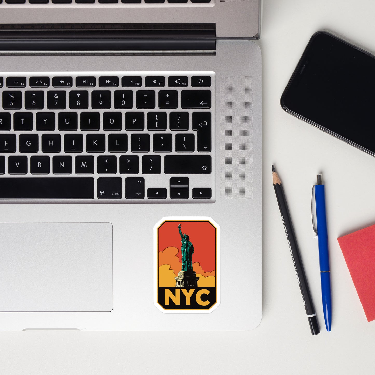 A sticker of New York City on a laptop