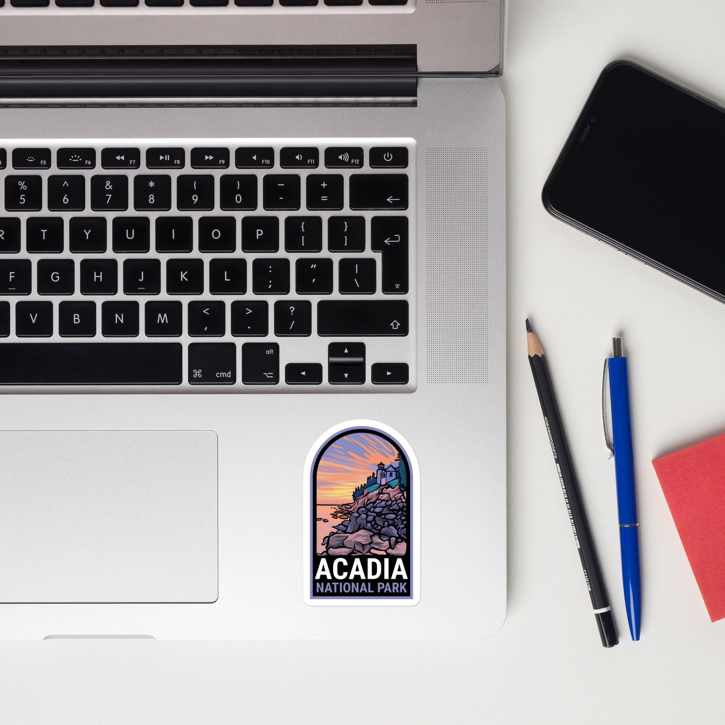 A sticker of Acadia National Park on a laptop