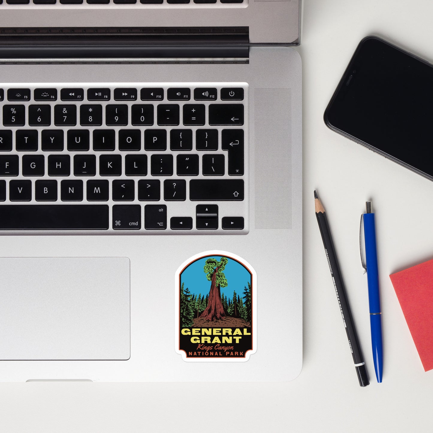 A sticker of General Grant tree on a laptop