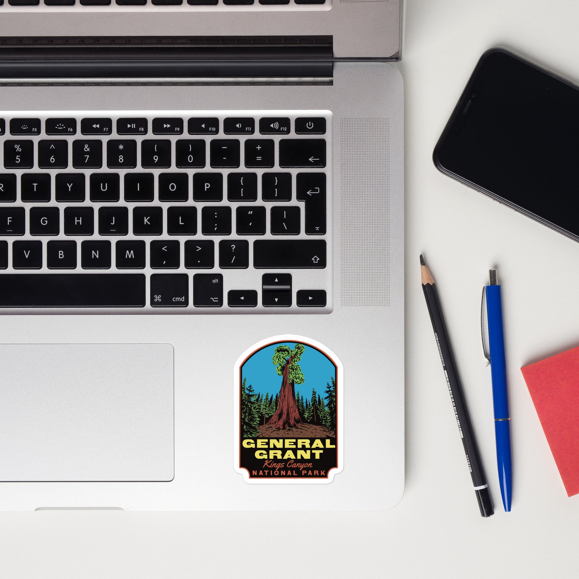 A sticker of General Grant tree on a laptop